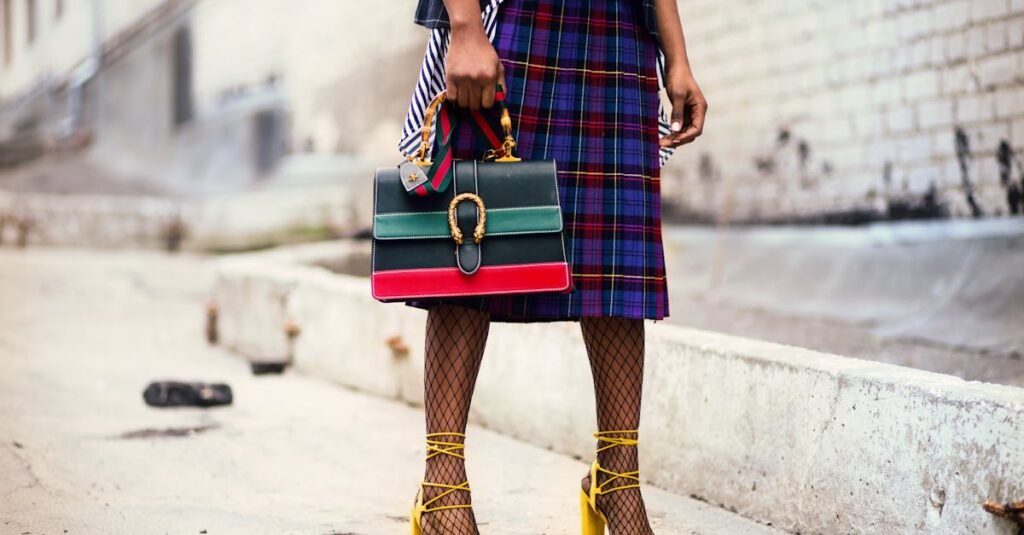 Fashion-forward outfit with plaid skirt and colorful handbag in urban setting.